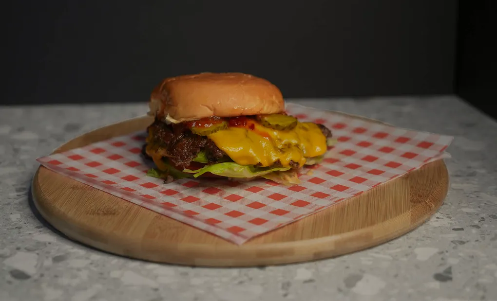 The same cheeseburger frame after colour grading